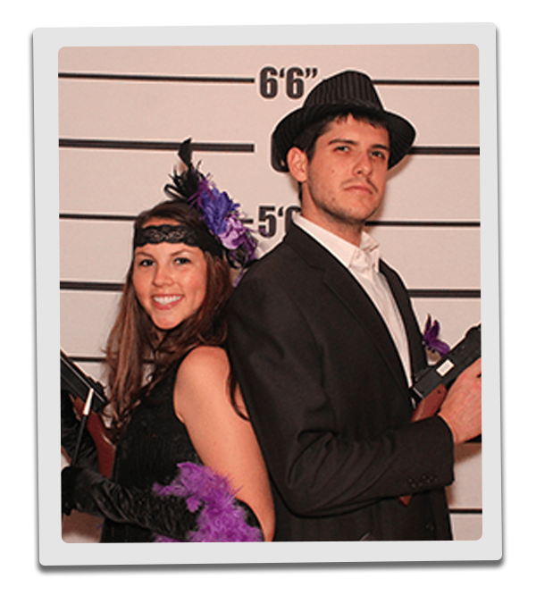 Houston Murder Mystery party guests pose for mugshots