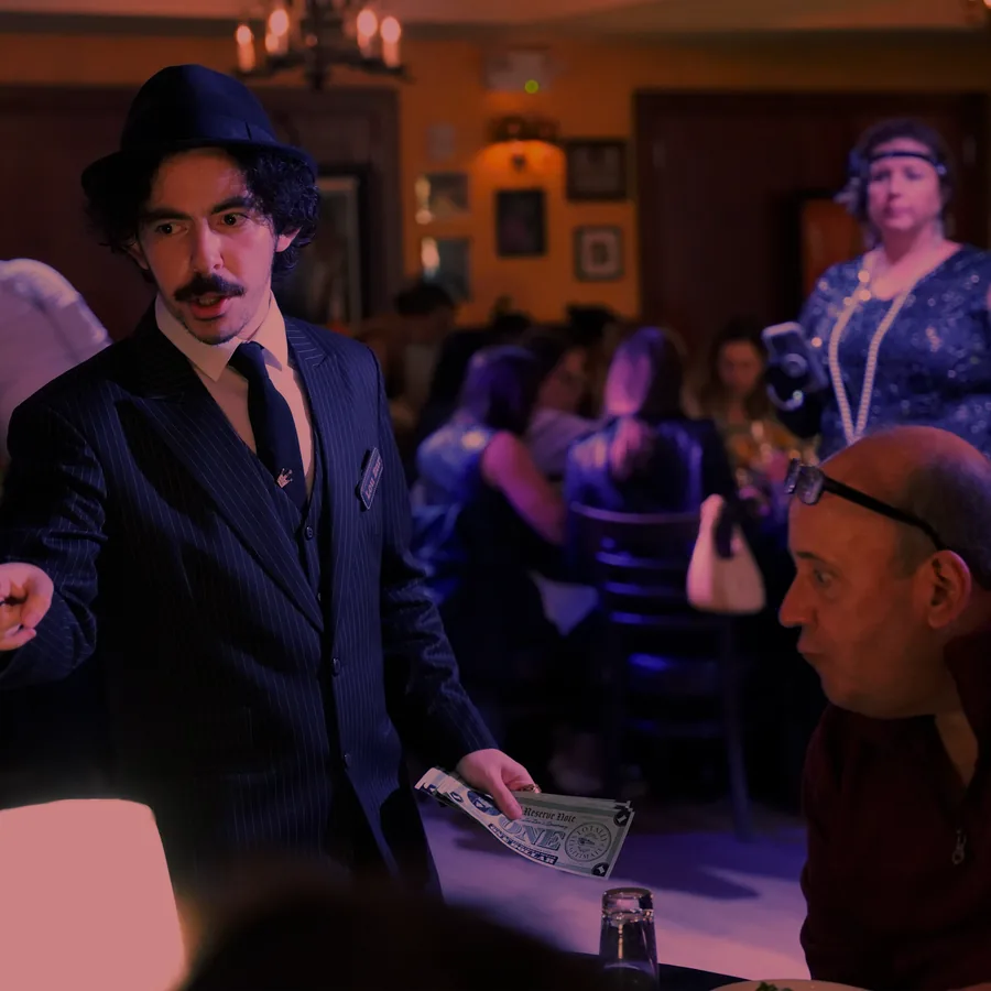 A Murder Mystery Company actor working the room at a Houston show