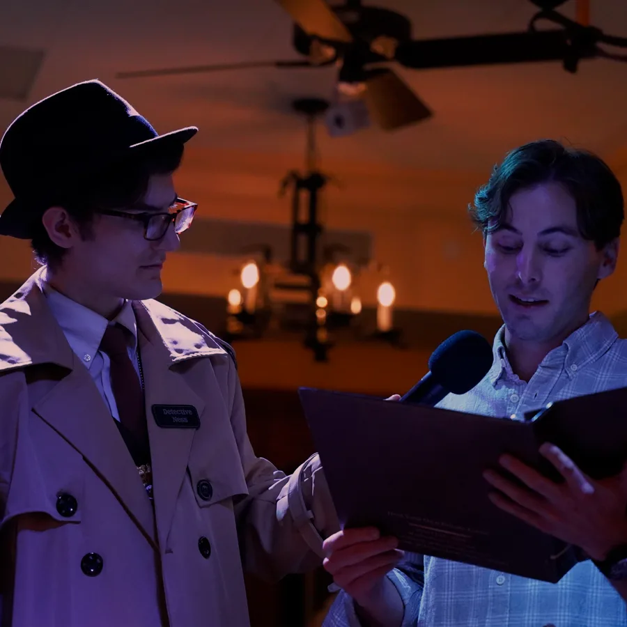 Professional actors performing at a Houston murder mystery